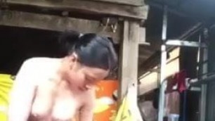 Khmer girl takes bath naked