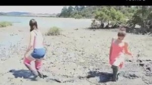 Two girls in thigh boots in very deep mud!!!