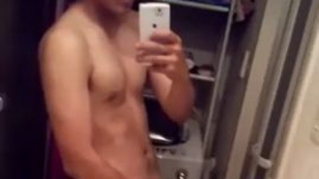 Asian twink strokes his meaty tool in the bathroom