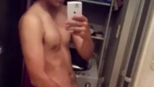 Asian twink strokes his meaty tool in the bathroom