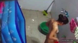 Asian stepdaughter spied in the bathhouse
